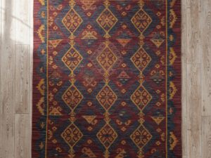 Traditional handwoven Shatranji rug with maroon and indigo geometric patterns.