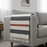 Modern minimalist striped Shatranji rug in charcoal grey and cream.