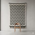 Monochrome black and white chevron pattern rug hanging as a wall tapestry.
