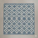 Shatranji rug with an intricate, mosaic-like tiled pattern in cool blue and grey tones.