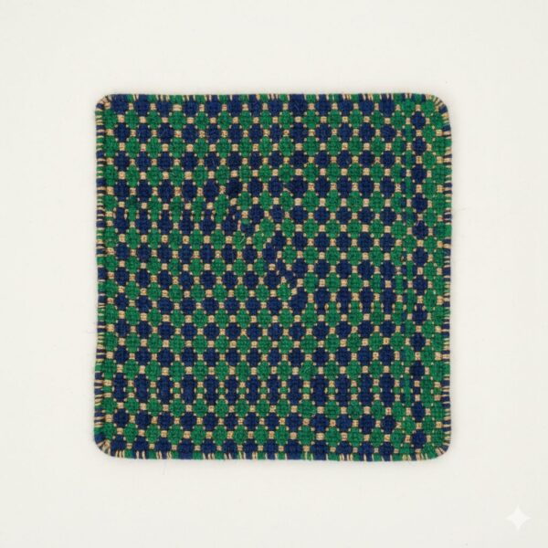 A small, square jewel-toned accent rug in sapphire blue and emerald green.