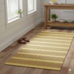 A cheerful, rustic hallway runner with alternating stripes of golden jute and bright yellow cotton.