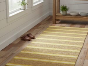 A cheerful, rustic hallway runner with alternating stripes of golden jute and bright yellow cotton.