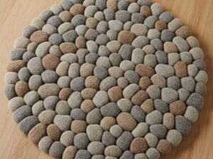 A unique accent rug with a multi-level weave that mimics the texture of riverbed pebbles.