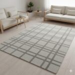 A subtle, minimalist grey rug with a tone-on-tone geometric pattern.